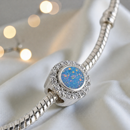 Baby blue sterling silver halo ashes memorial charm, handcrafted in Lancashire by keepsake memorial