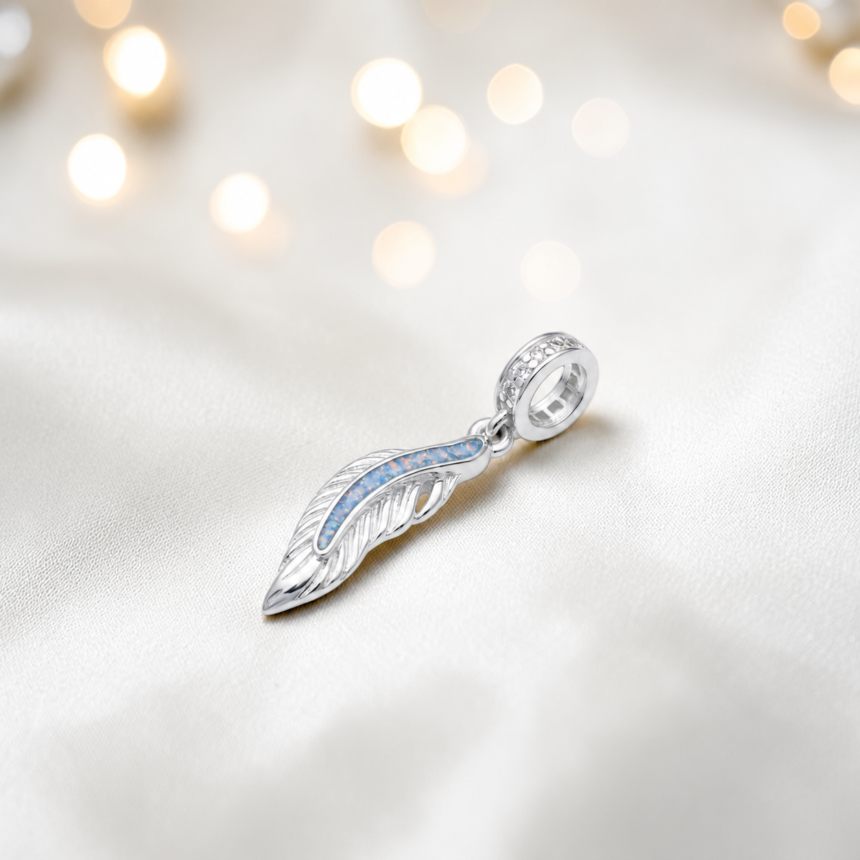 Baby blue sterling silver heavens feather  ashes memorial dangle  charm, handcrafted in Lancashire by keepsake memorial