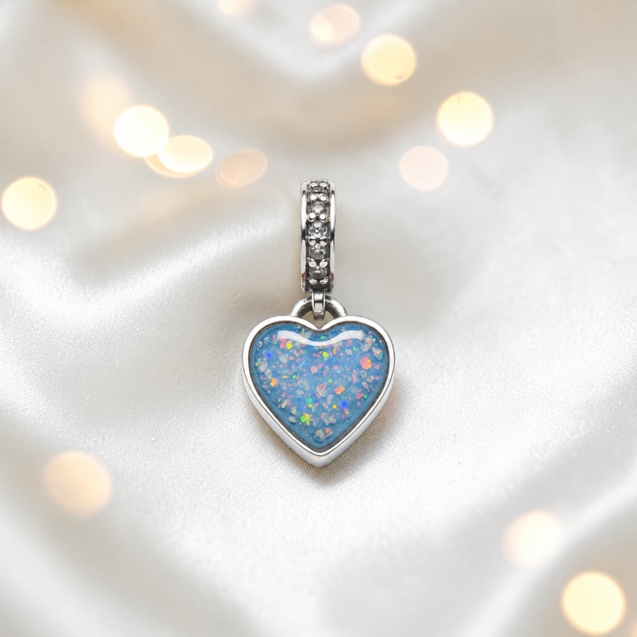 Baby blue sterling silver heavens heart ashes memorial dangle  charm, handcrafted in Lancashire by keepsake memorial