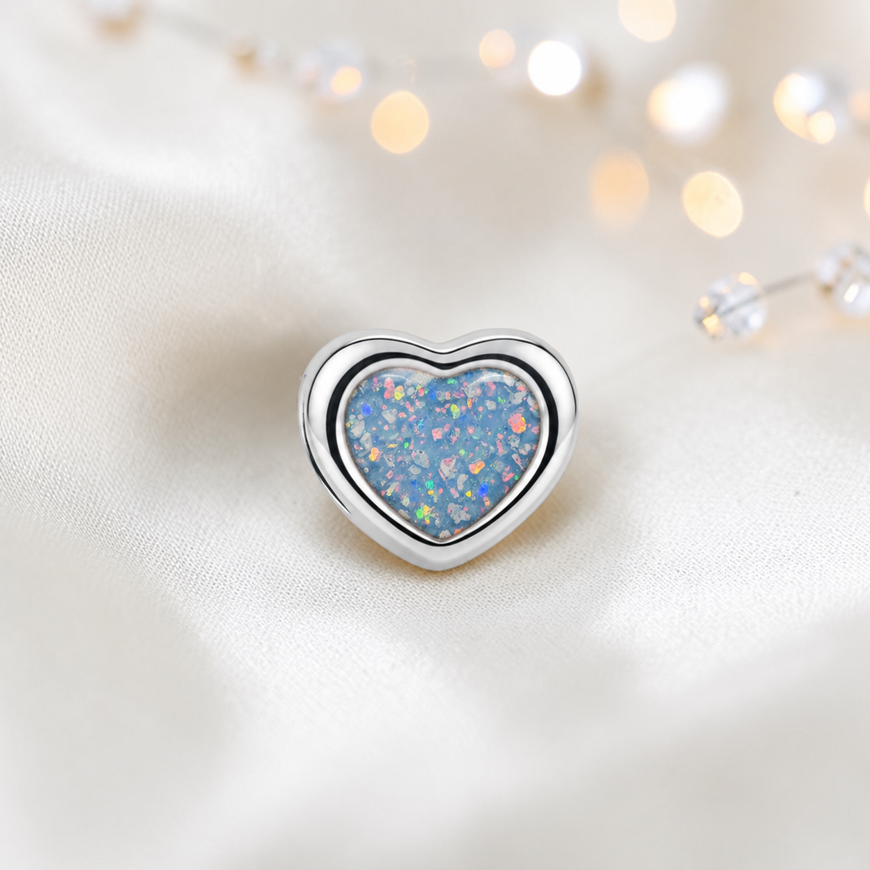 Baby blue sterling silver peaceful heart ashes memorial charm, handcrafted in Lancashire by keepsake memorial