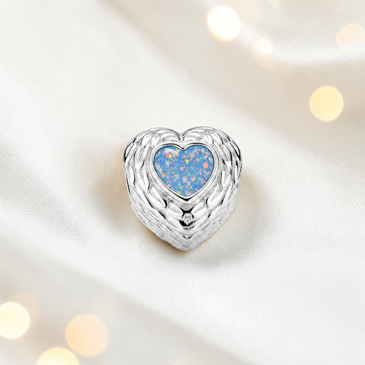 Baby blue sterling silver peaceful whisper heart ashes memorial charm, handcrafted in Lancashire by keepsake memorial