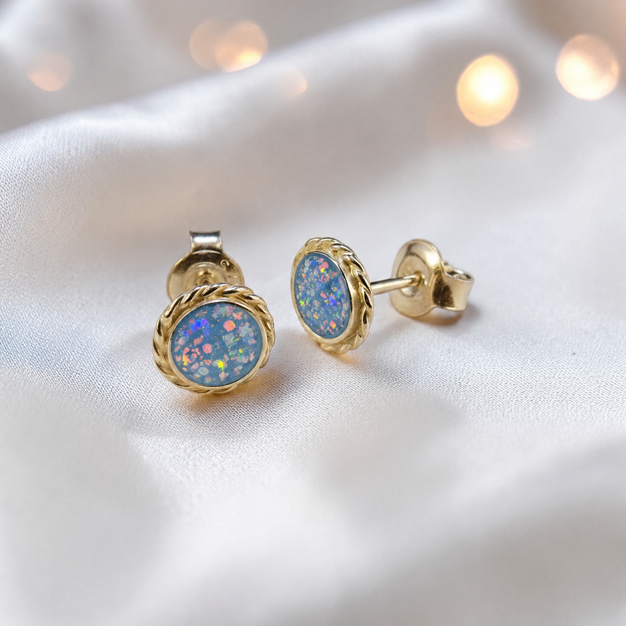 Eterna memorial stud earrings in Baby opal — sterling silver rope edge, handcrafted in Lancashire, UK