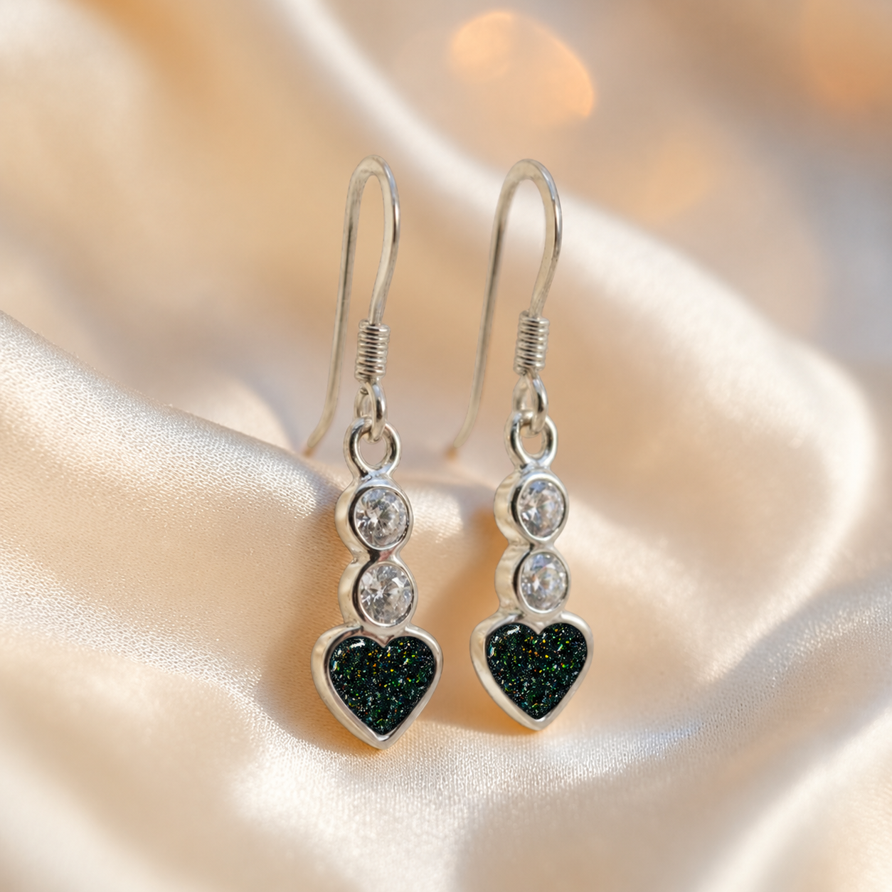 Pleione Earrings — silver heart drop ashes memorial earrings in Black Flame resin, handcrafted in Lancashire, UK
