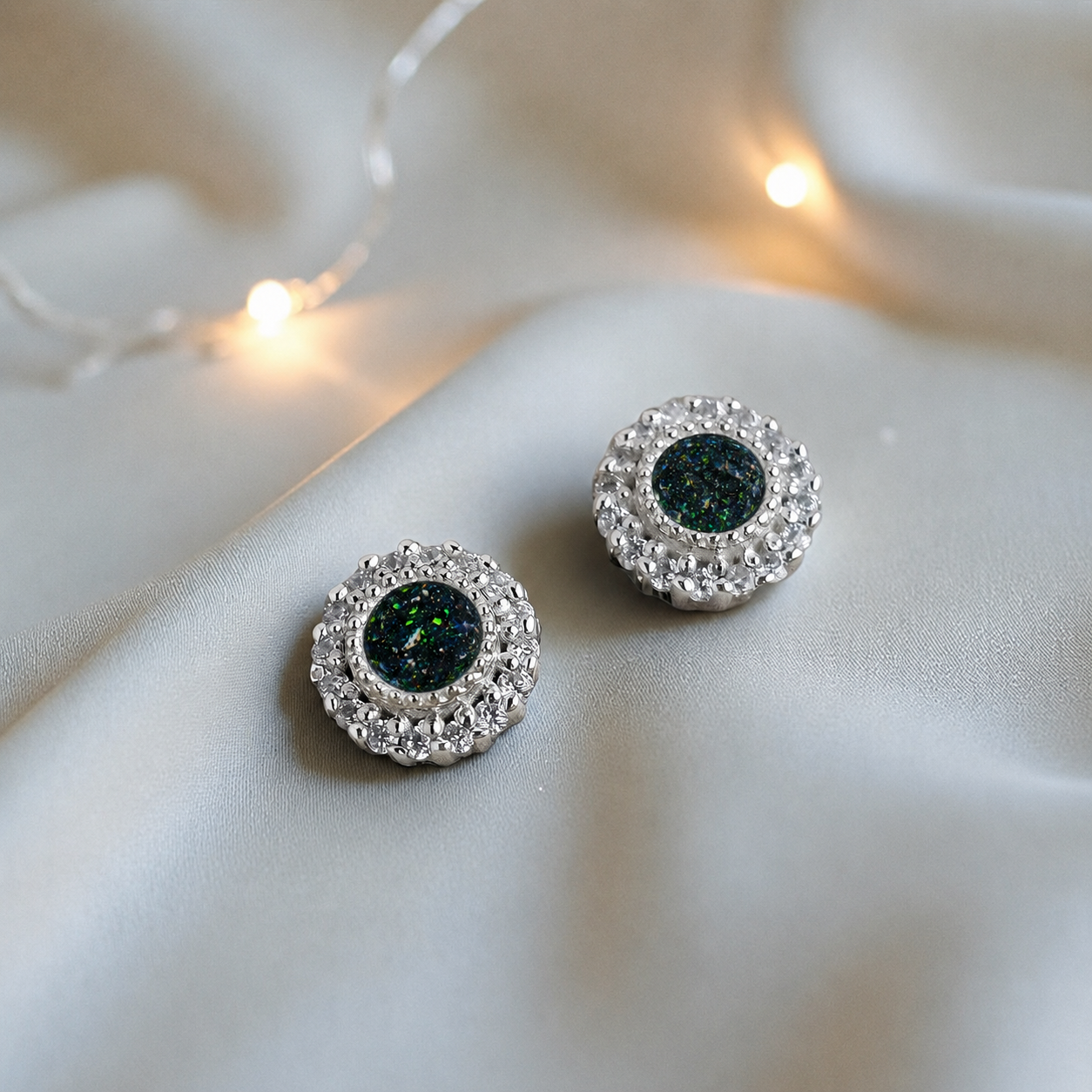 Halo's memorial stud earrings in Black Flame opal — sterling silver, handcrafted in Lancashire, UK