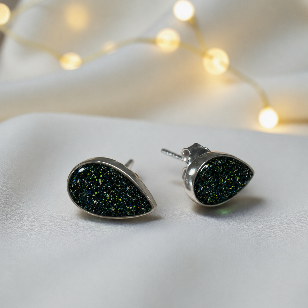 Pure Radiance memorial earrings in Black Flame opal — sterling silver, handcrafted in Lancashire, UK