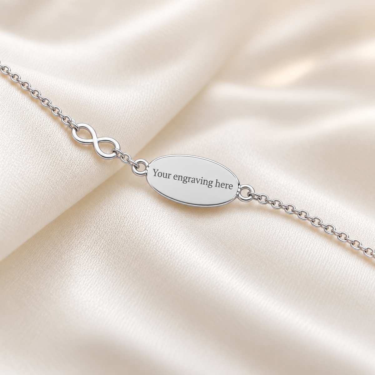 Engraved Lumen Bracelet — silver oval infinity ashes memorial bracelet, handcrafted in Lancashire, UK