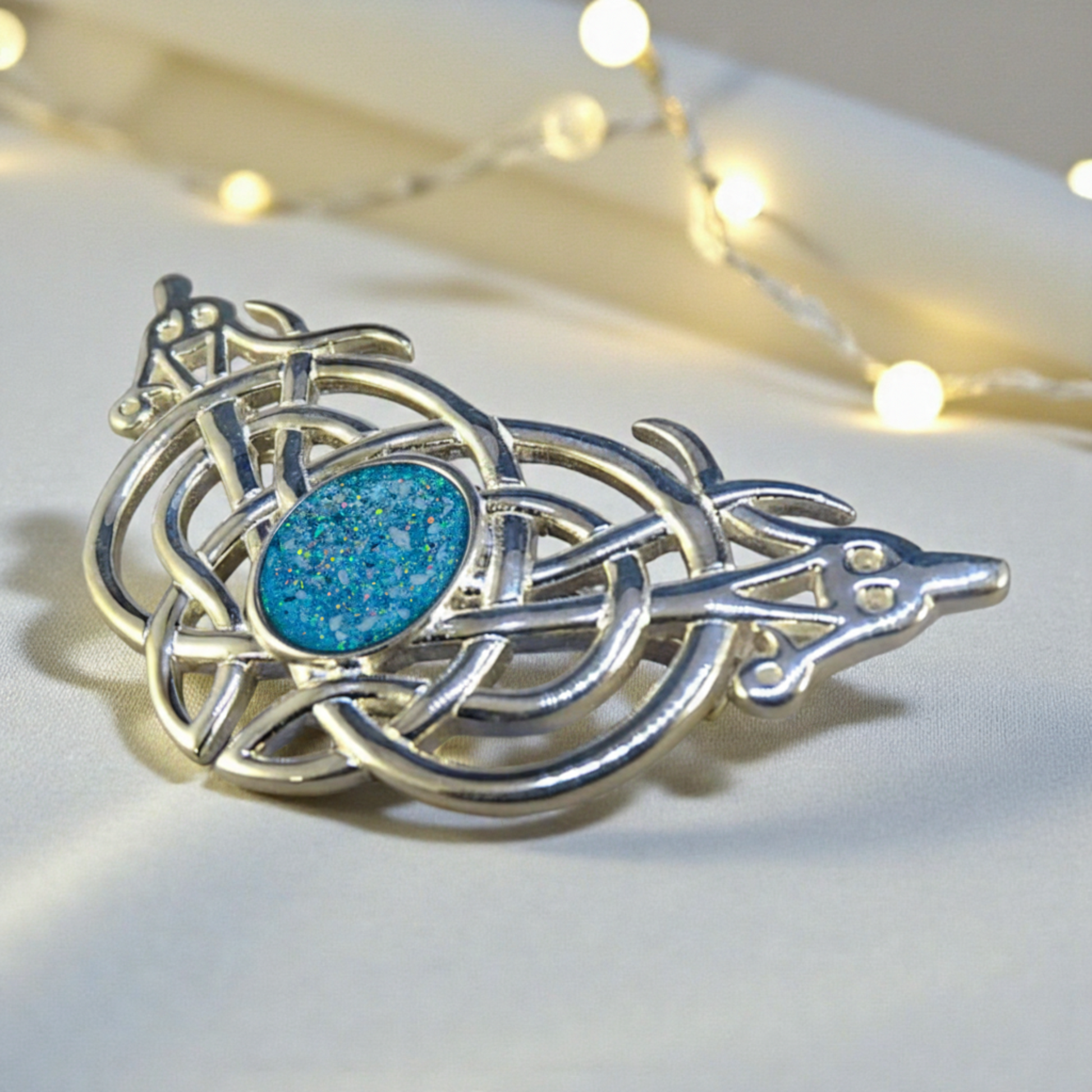 Caledonia Brooch — silver Celtic ashes memorial brooch with blue opal centre setting, handcrafted in Lancashire, UK
