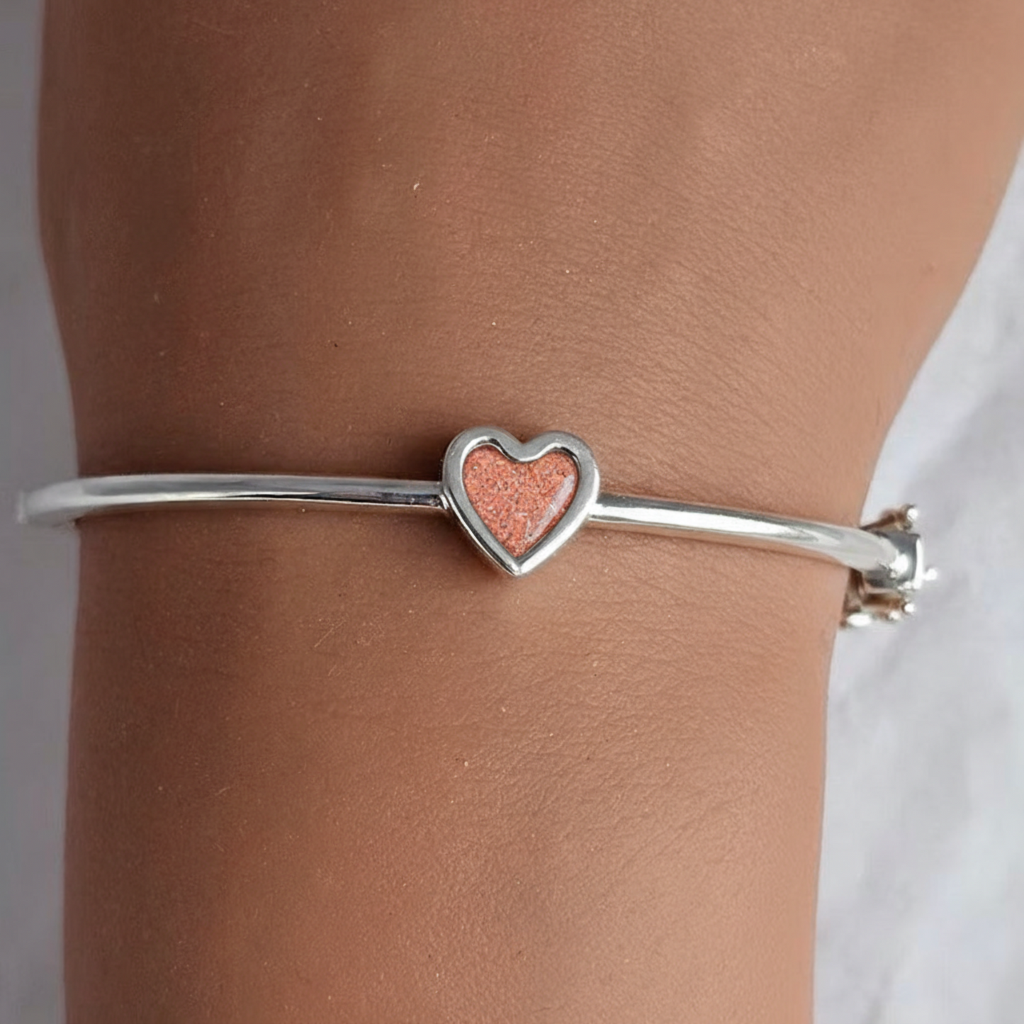 Cassia Heart Bangle — silver heart ashes memorial bangle with copper red opal, handcrafted in Lancashire, UK