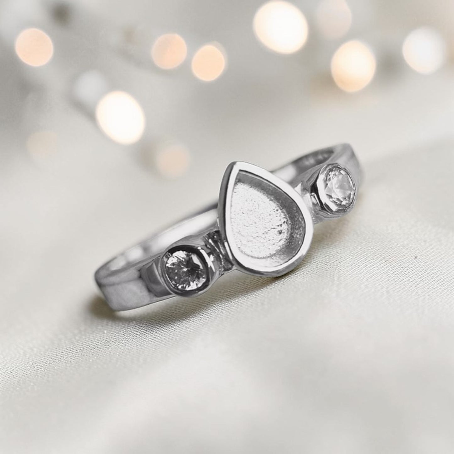 Cassiel Ring — silver teardrop pear ashes memorial ring, alternative angle, handcrafted in Lancashire, UK