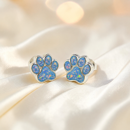 Cleo pet paw memorial ear studs in Baby Blue opal — sterling silver, handcrafted in Lancashire, UK