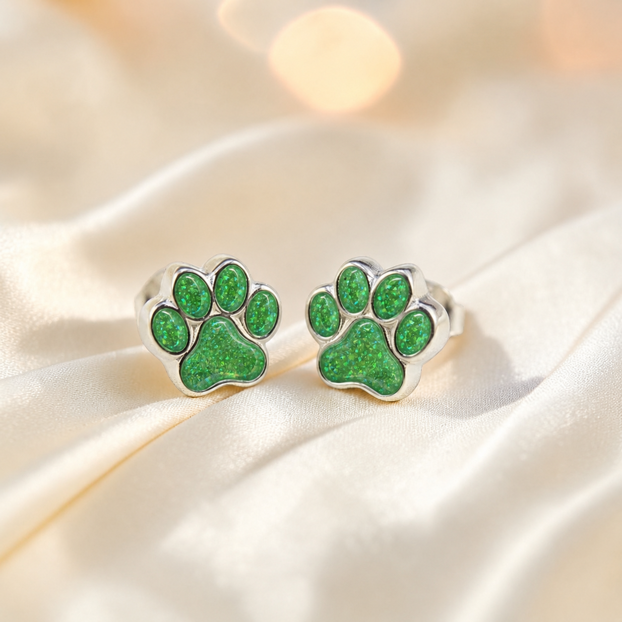 Cleo pet paw memorial ear studs in Fruit Green opal — sterling silver, handcrafted in Lancashire, UK
