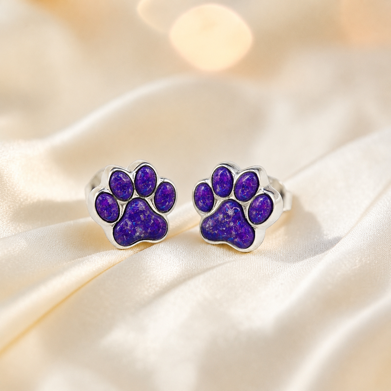Cleo pet paw memorial ear studs in Sleepy Lavender opal — sterling silver, handcrafted in Lancashire, UK