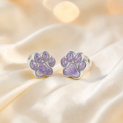 Cleo pet paw memorial ear studs in Unicorn Purple opal — sterling silver, handcrafted in Lancashire, UK