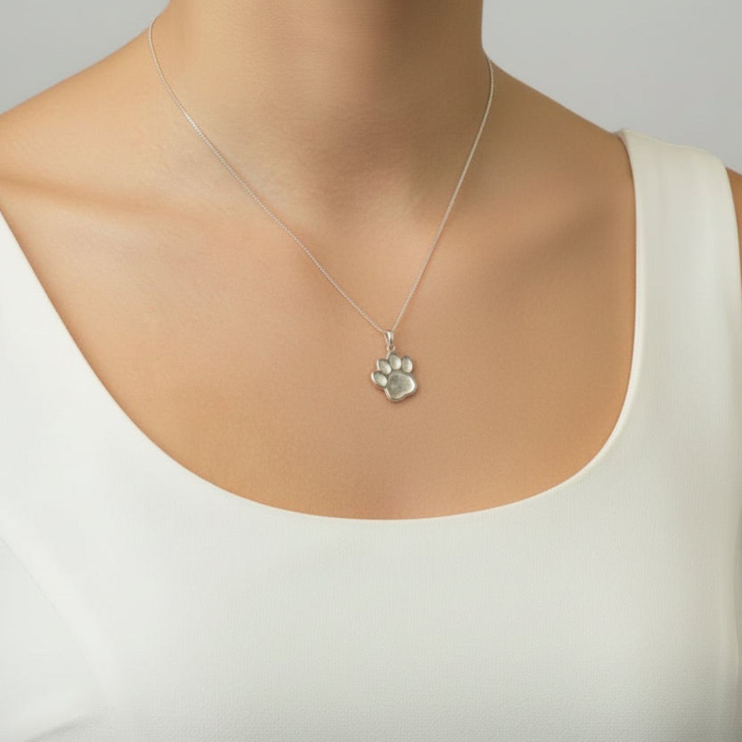 Daisy Pendant - silver dog paw memorial ashes pendant , worn by model, handcrafted in Lancashire UK - Keepsake Memorial Jewellery