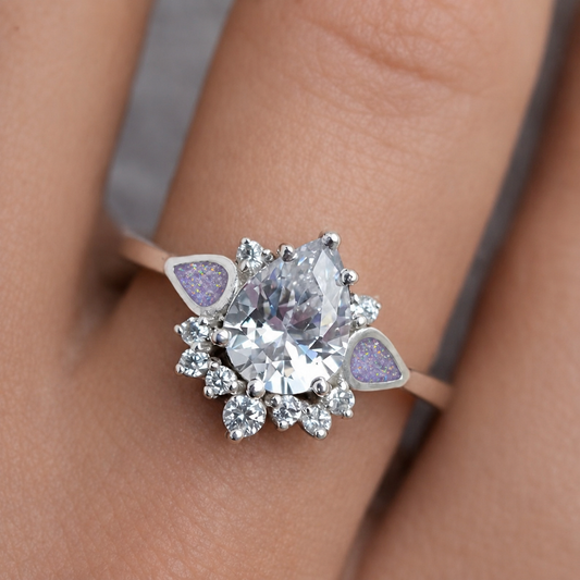 dew drop memorial ashes ring, in unicorn purple shown on finger, Lancashire 