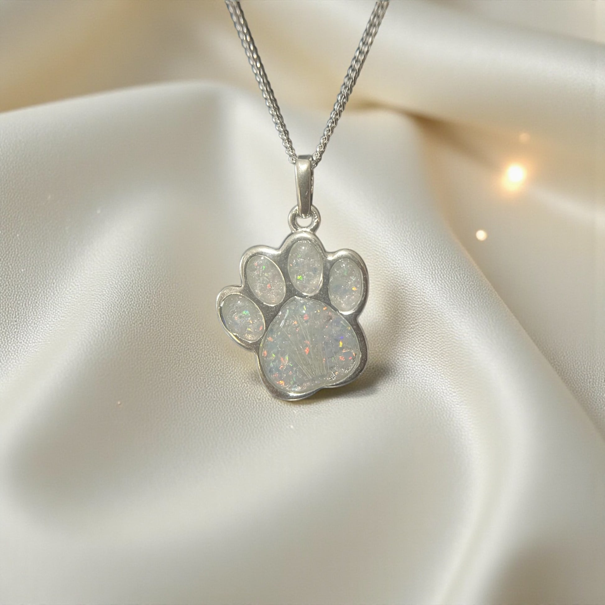 silver dog paw memorial pendant, handcrafted in lancashire