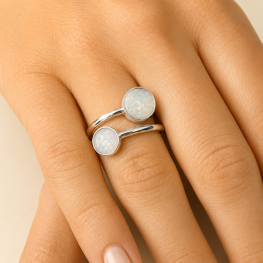 Elysia keepsake memorial ring ashes  in white snow on hand, handcrafted in lancashire