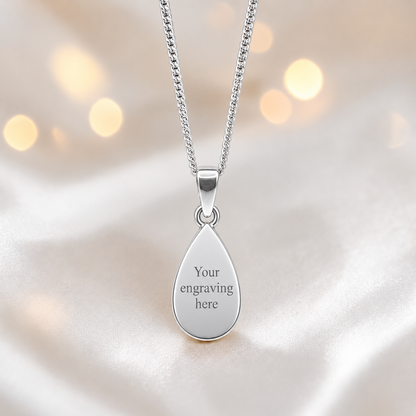 Engraved Vega sterling silver teardrop memorial pendant for holding ashes or hair, handcrafted in the UK