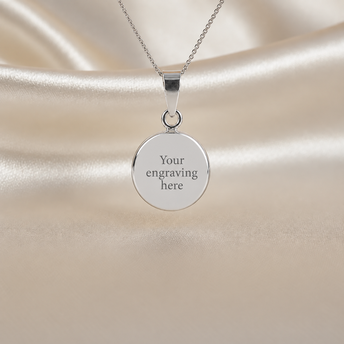 keepsake memorial jewellery round pollux pendant with engraving on rear. Handcrafted in Lancashire