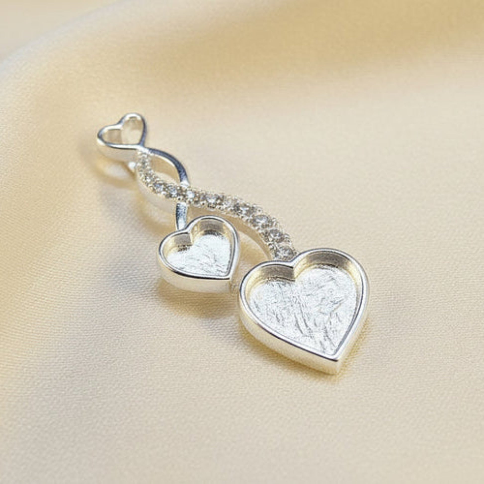 silver keepsake entwined heart pendant, handcrafted in uk