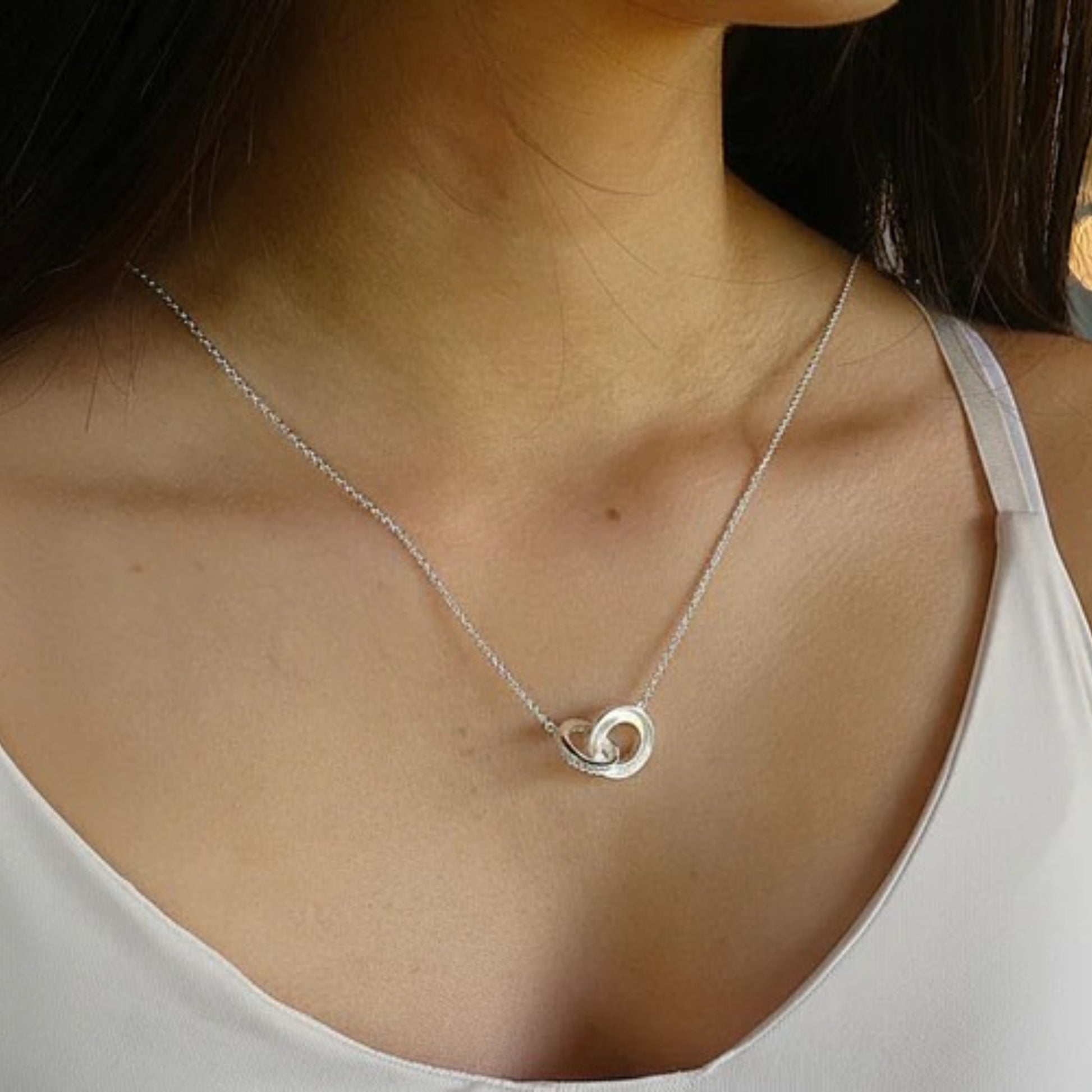 Silver ring memorial pendant, on model, handcrafted in Lancashire Uk