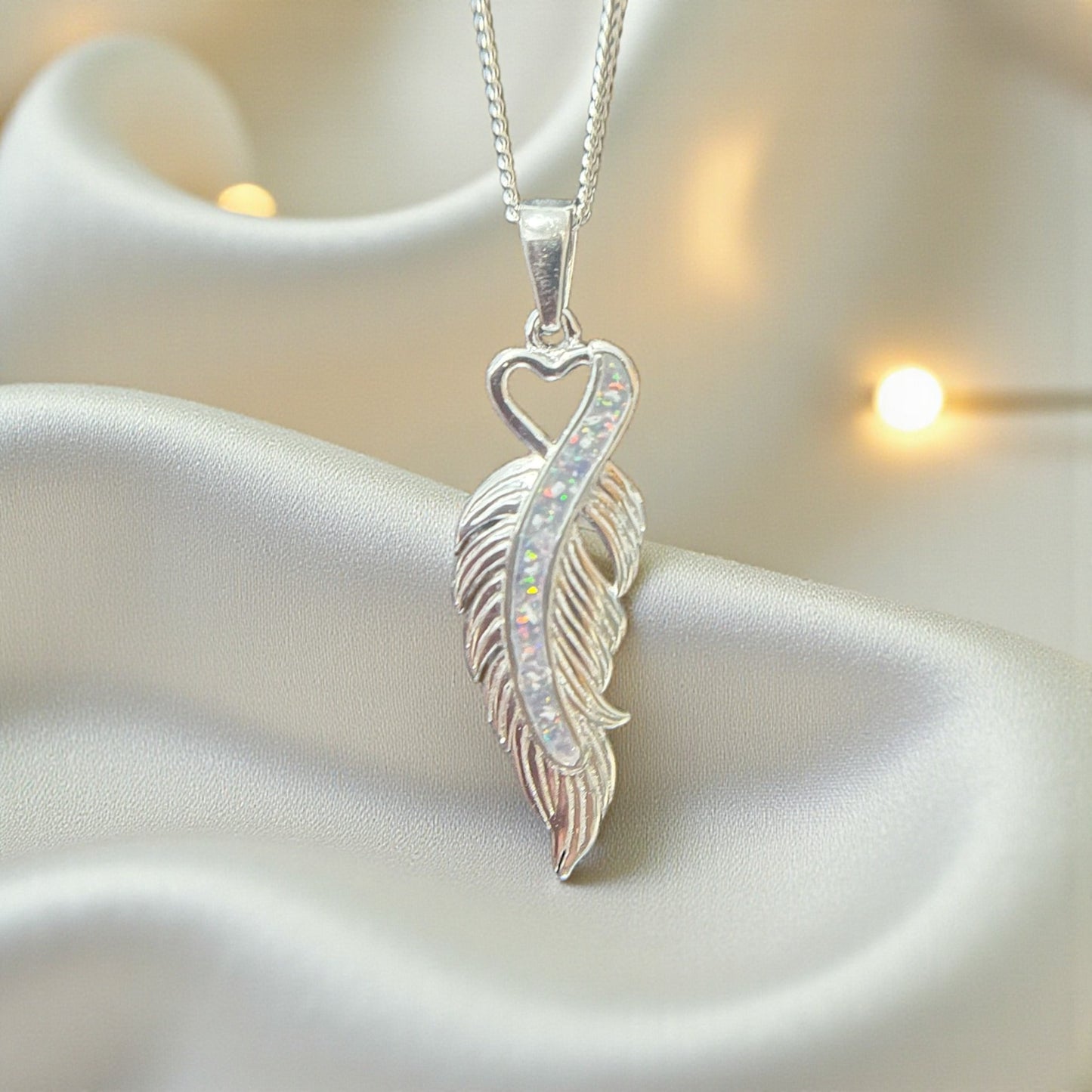 silver feather ashes pendant, handcrafted in lancashire, uk