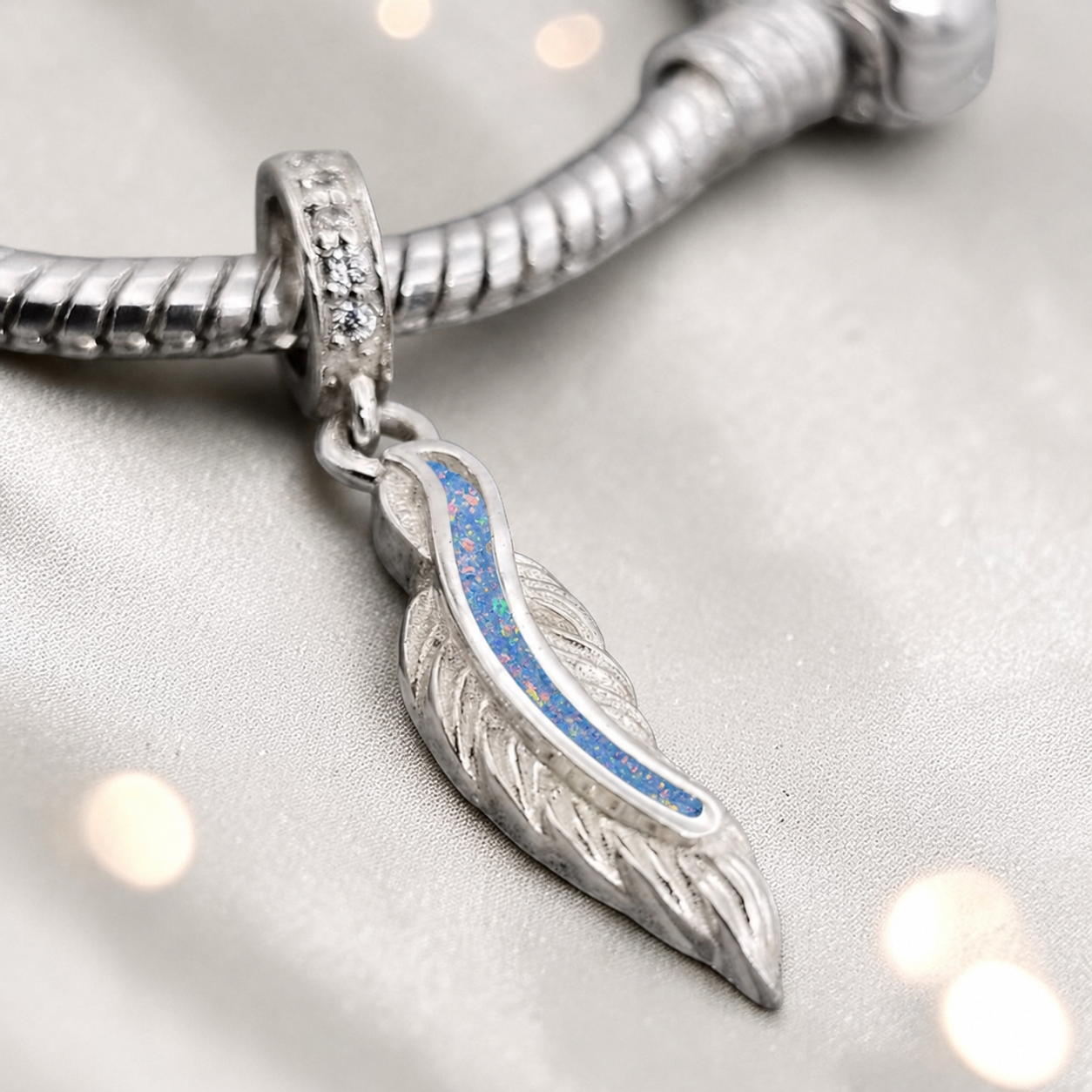 sterling silver heavens feather  ashes memorial dangle  charm, handcrafted in Lancashire by keepsake memorial
