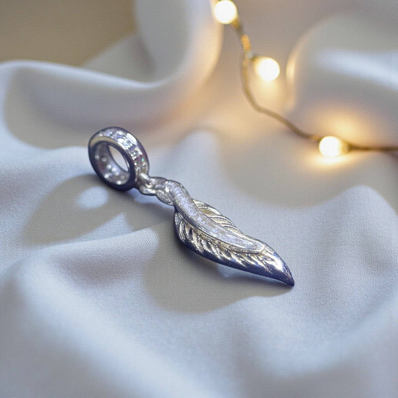 silver feather dangle ashes charm, handcrafted in lancashire, uk
