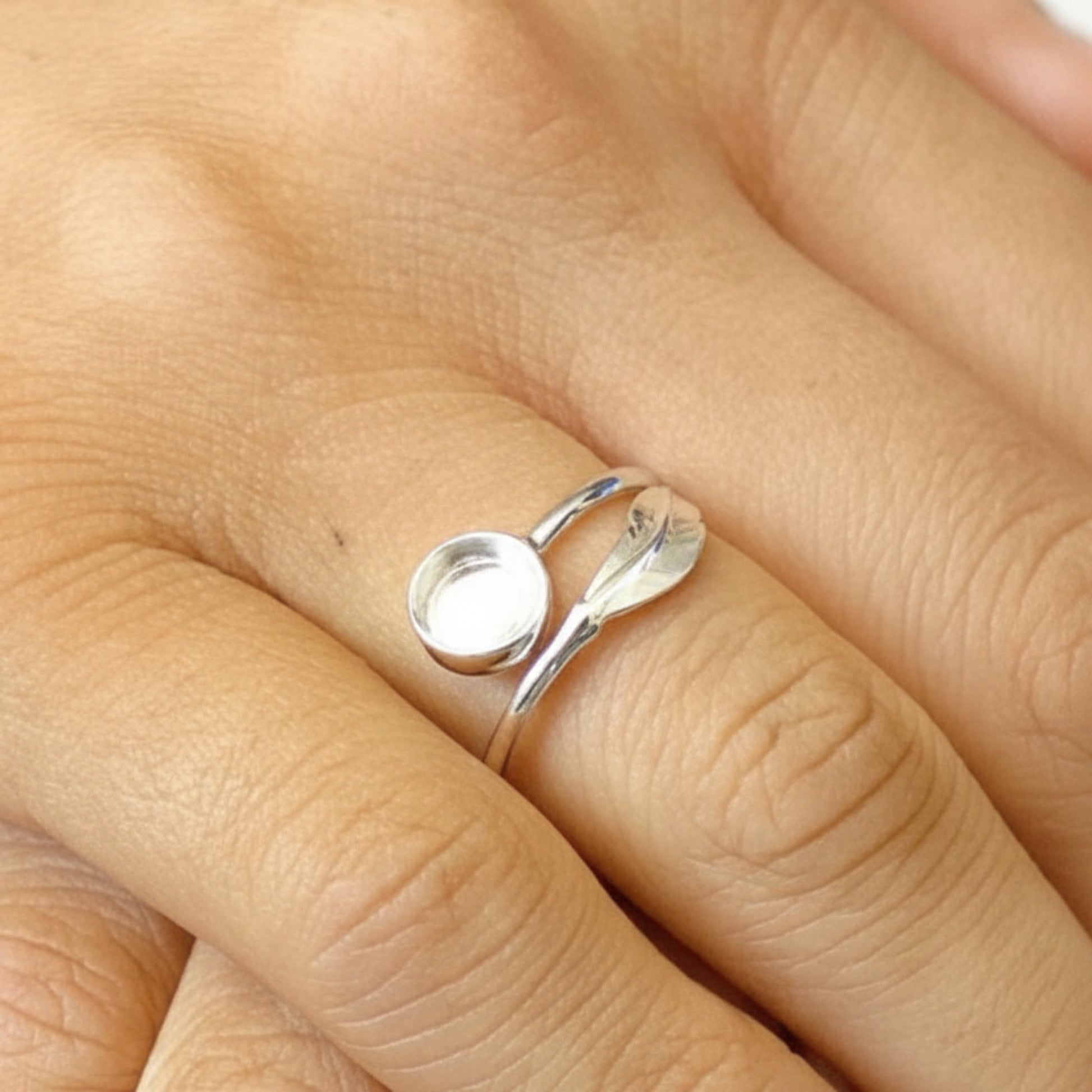 Feather Whisper Ring worn on hand — silver feather ashes memorial ring, handcrafted in the UK