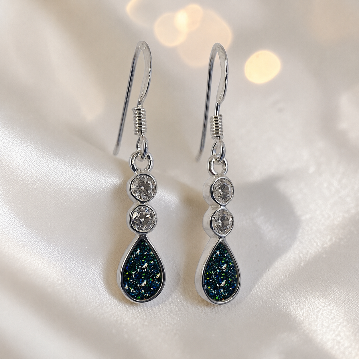 Acrux Earrings — silver pear drop ashes memorial earrings in Black Flame resin, handcrafted in Lancashire, UK