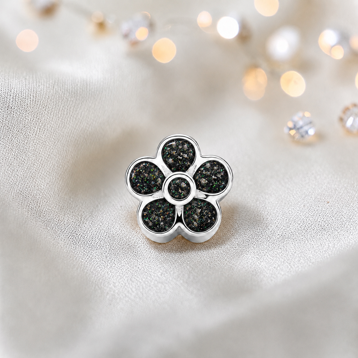 Black flame sterling silver flora, flower ashes memorial charm, handcrafted in Lancashire by keepsake memorial