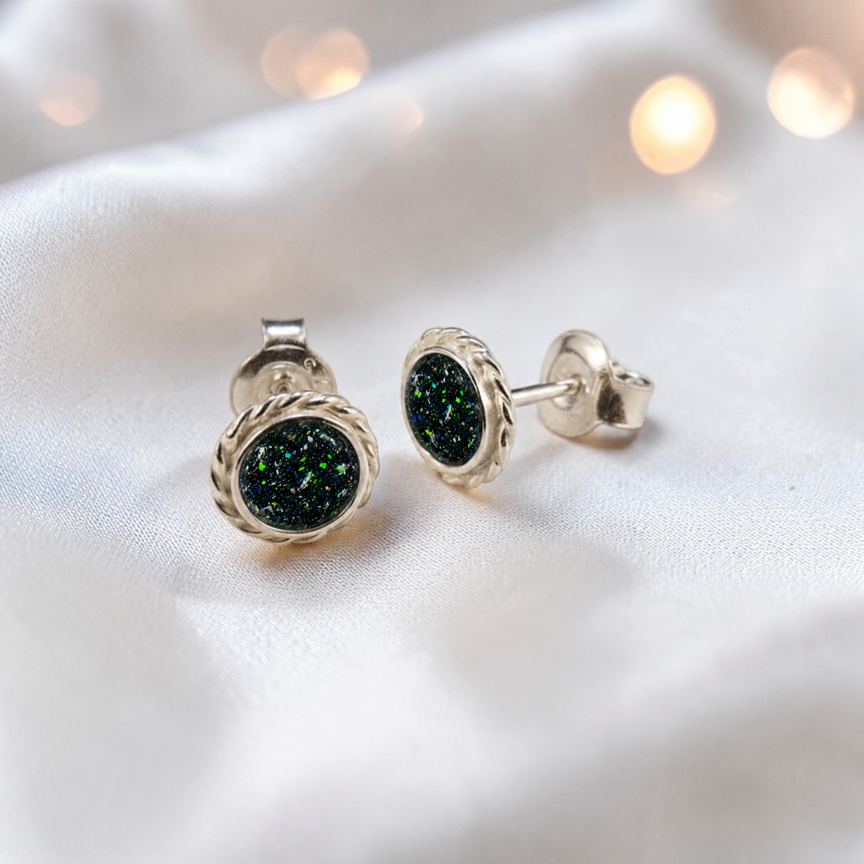 Eterna memorial stud earrings in Flame opal — sterling silver rope edge, handcrafted in Lancashire, UK