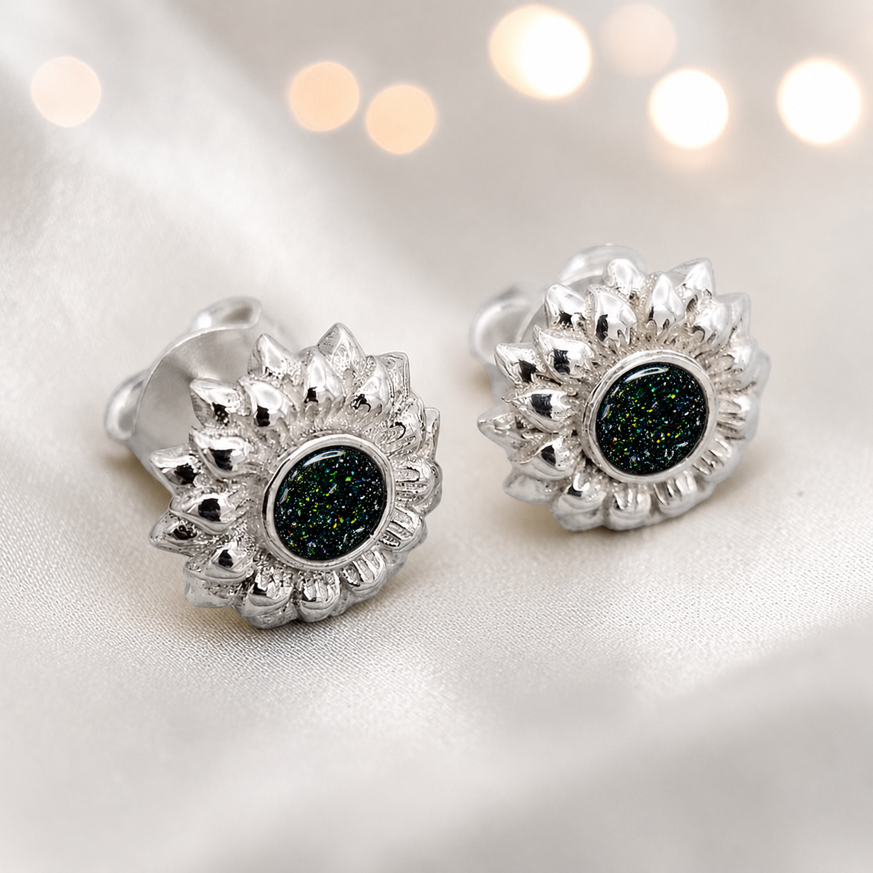 Flora Earrings — silver sunflower ashes memorial stud earrings in Black Flame resin, handcrafted in Lancashire, UK
