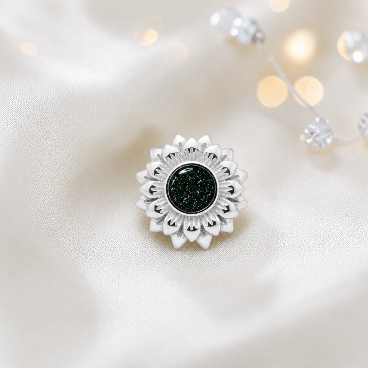 Black flame sterling silver sunflower ashes memorial charm, handcrafted in Lancashire by keepsake memorial