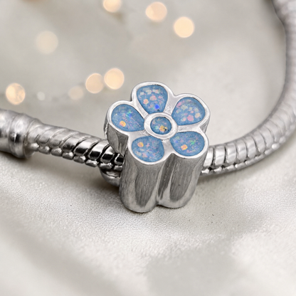 Baby blue sterling silver flora, flower ashes memorial charm, handcrafted in Lancashire by keepsake memorial