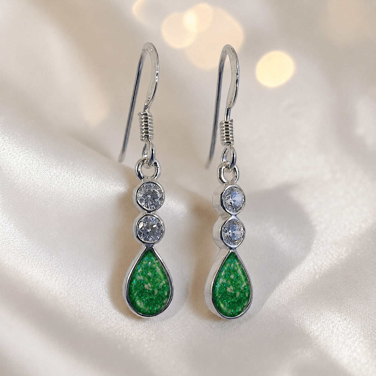 Acrux Earrings — silver pear drop ashes memorial earrings in Fruit Green resin, handcrafted in Lancashire, UK