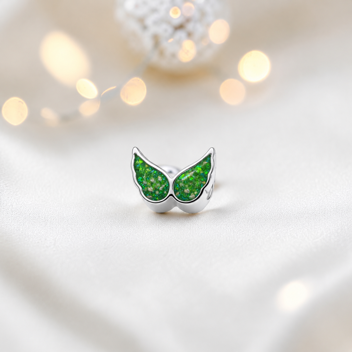 Fruit green sterling silver angel wing ashes memorial charm, handcrafted in Lancashire by keepsake memorial
