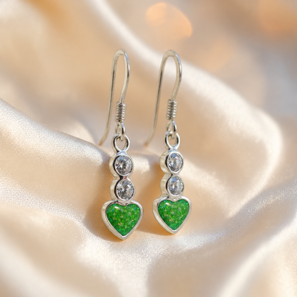 Pleione Earrings — silver heart drop ashes memorial earrings in Fruit Green resin, handcrafted in Lancashire, UK