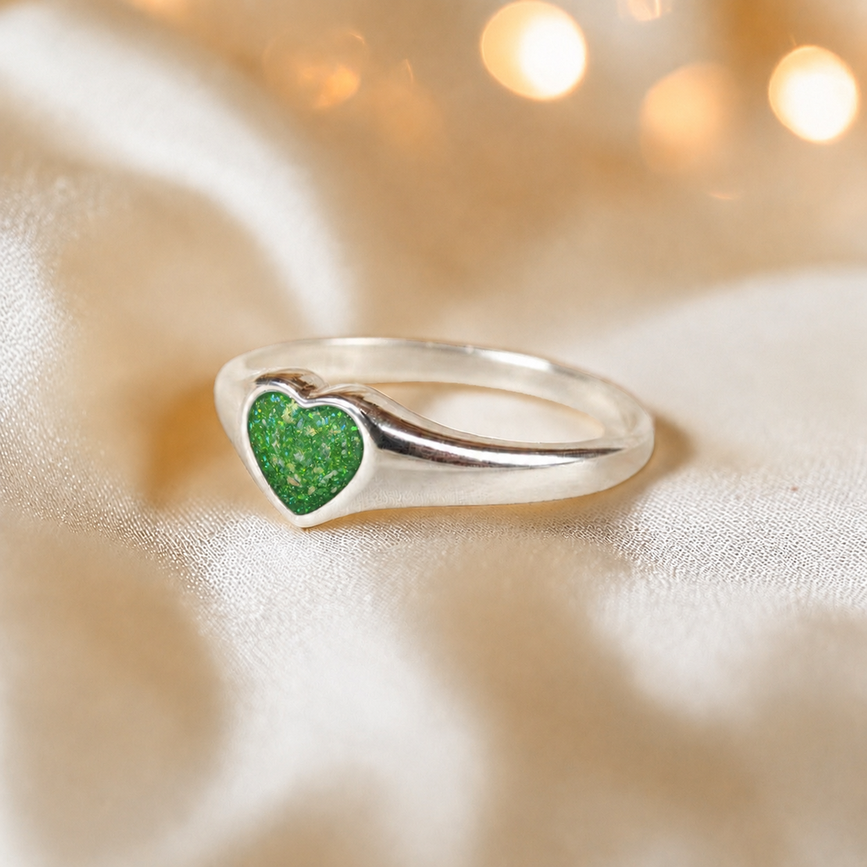Eden Heart shaped memorial ashes ring in fruit green,  handcrafted in Lancashire, UK.