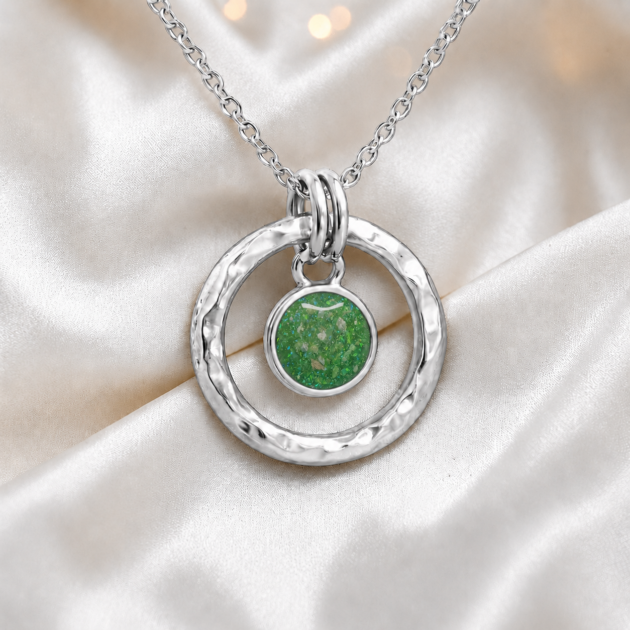 Fruit green hammered hollow circle sterling silver memorial pendant, handcrafted in Lancashire UK by Keepsake Memorial Jewellery

