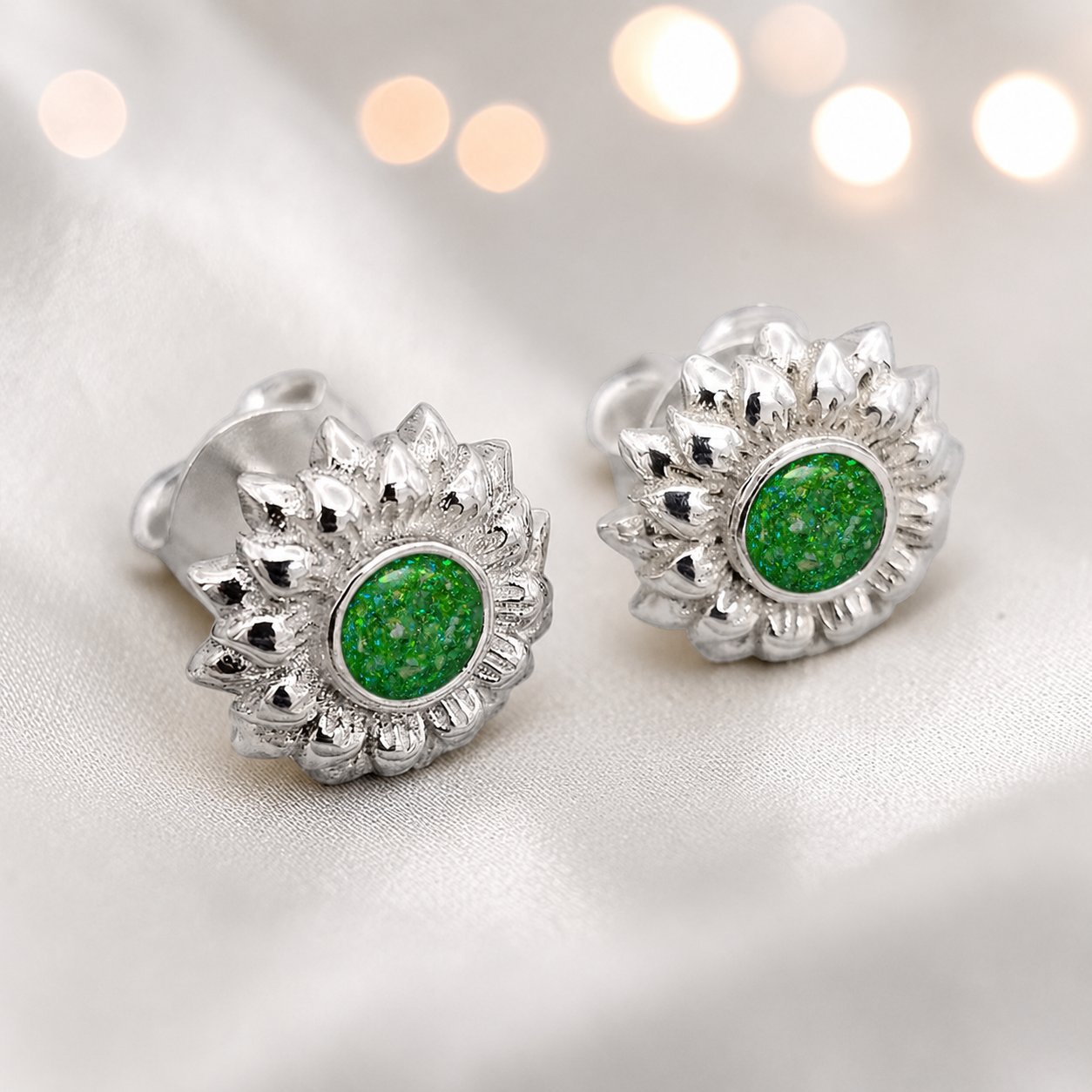 Flora Earrings — silver sunflower ashes memorial stud earrings in Fruit Green resin, handcrafted in Lancashire, UK