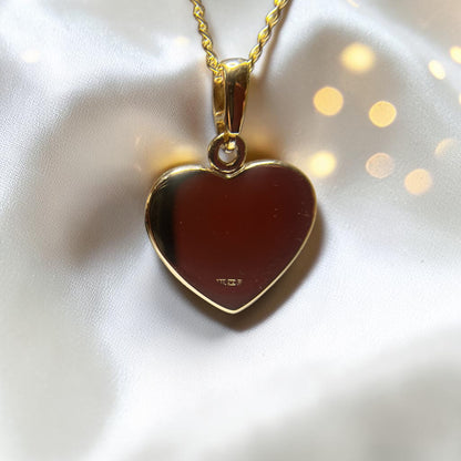 9ct gold heart ashes memorial pendant, rear view showing hallmarking. Handcrafted in lancashire 