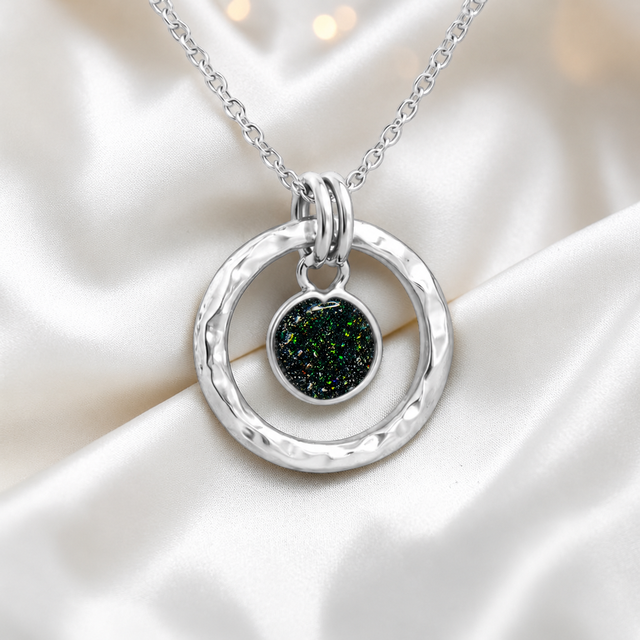 Black flame hammered hollow circle sterling silver memorial pendant, handcrafted in Lancashire UK by Keepsake Memorial Jewellery
