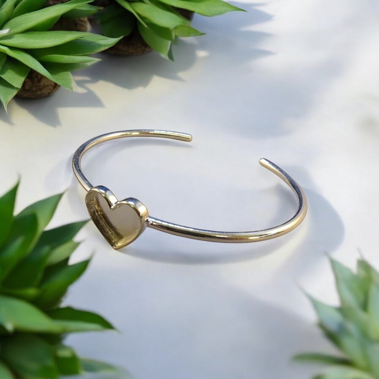 Solid Silver Bangle with Heart shaped setting