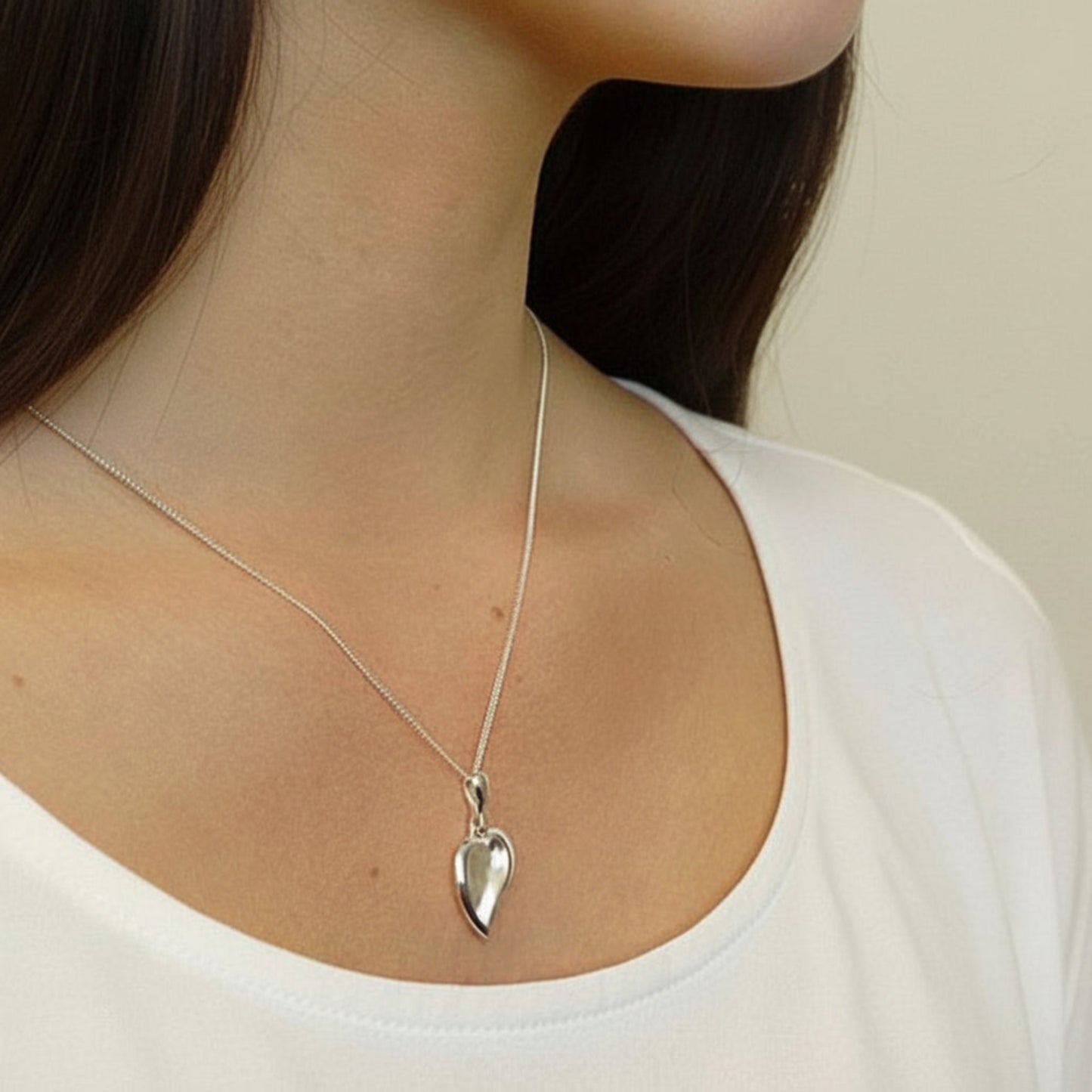 silver heart pendant on model uk