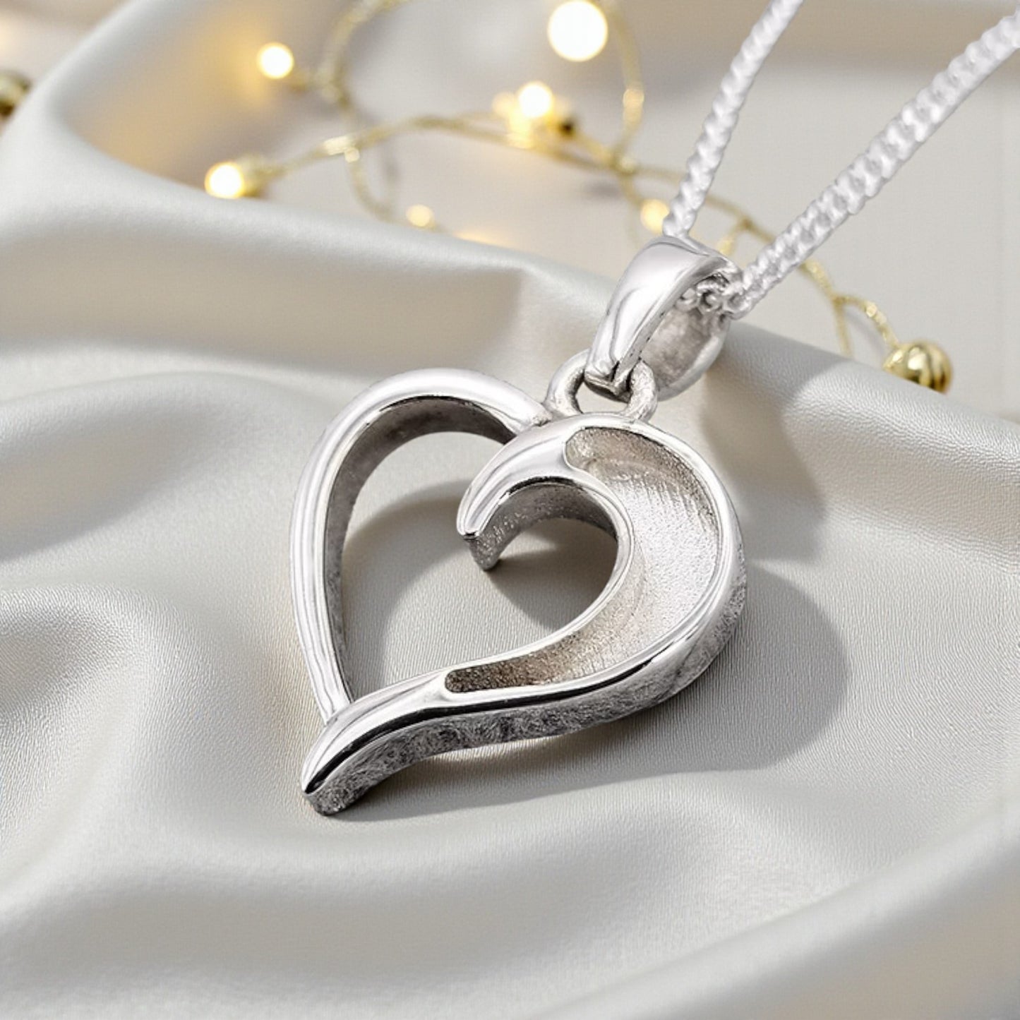 silver hollow heart ashes pendant, handcrafted in lancashire