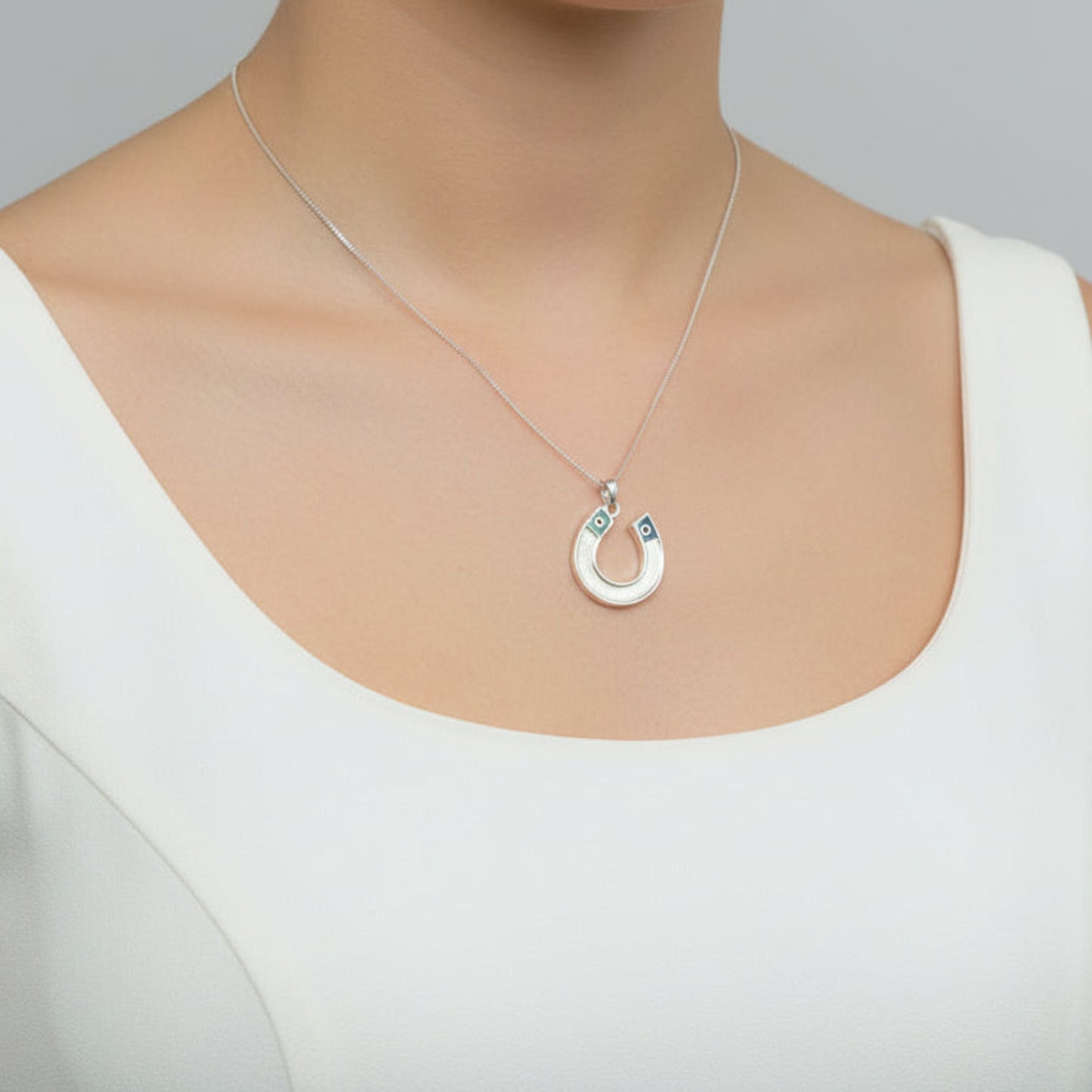 silver horseshoe memory pendant on neck rossendale 