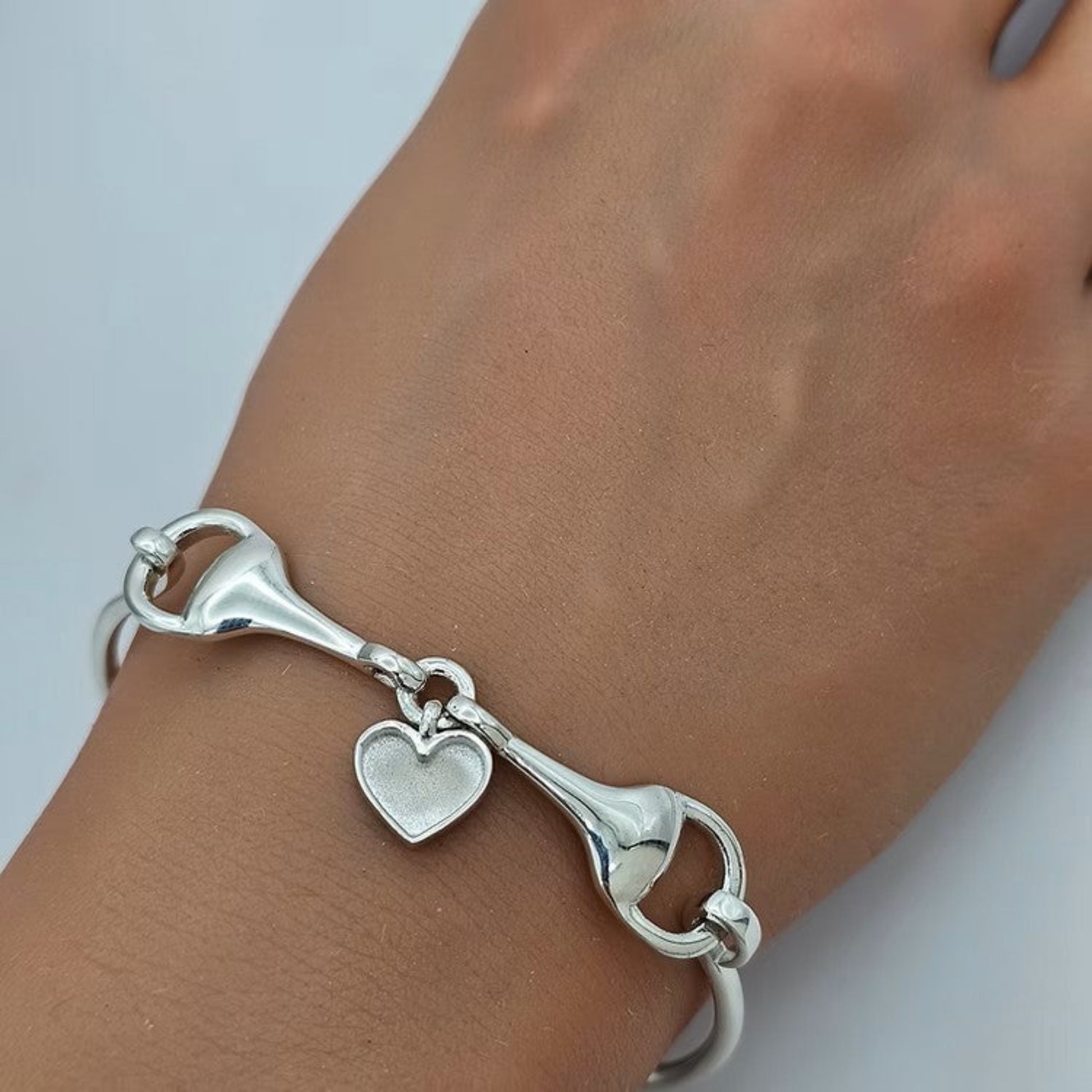 horse snaffle memorial bangle on wrist, uk