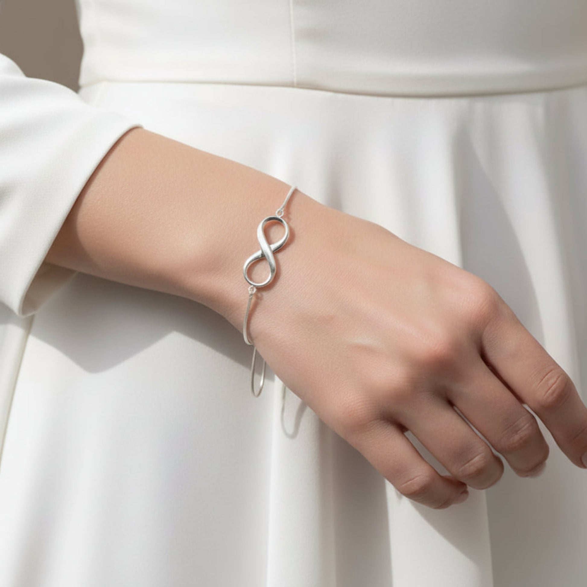 Infinity Bracelet — silver infinity ashes memorial bracelet worn on wrist, handcrafted in Lancashire, UK