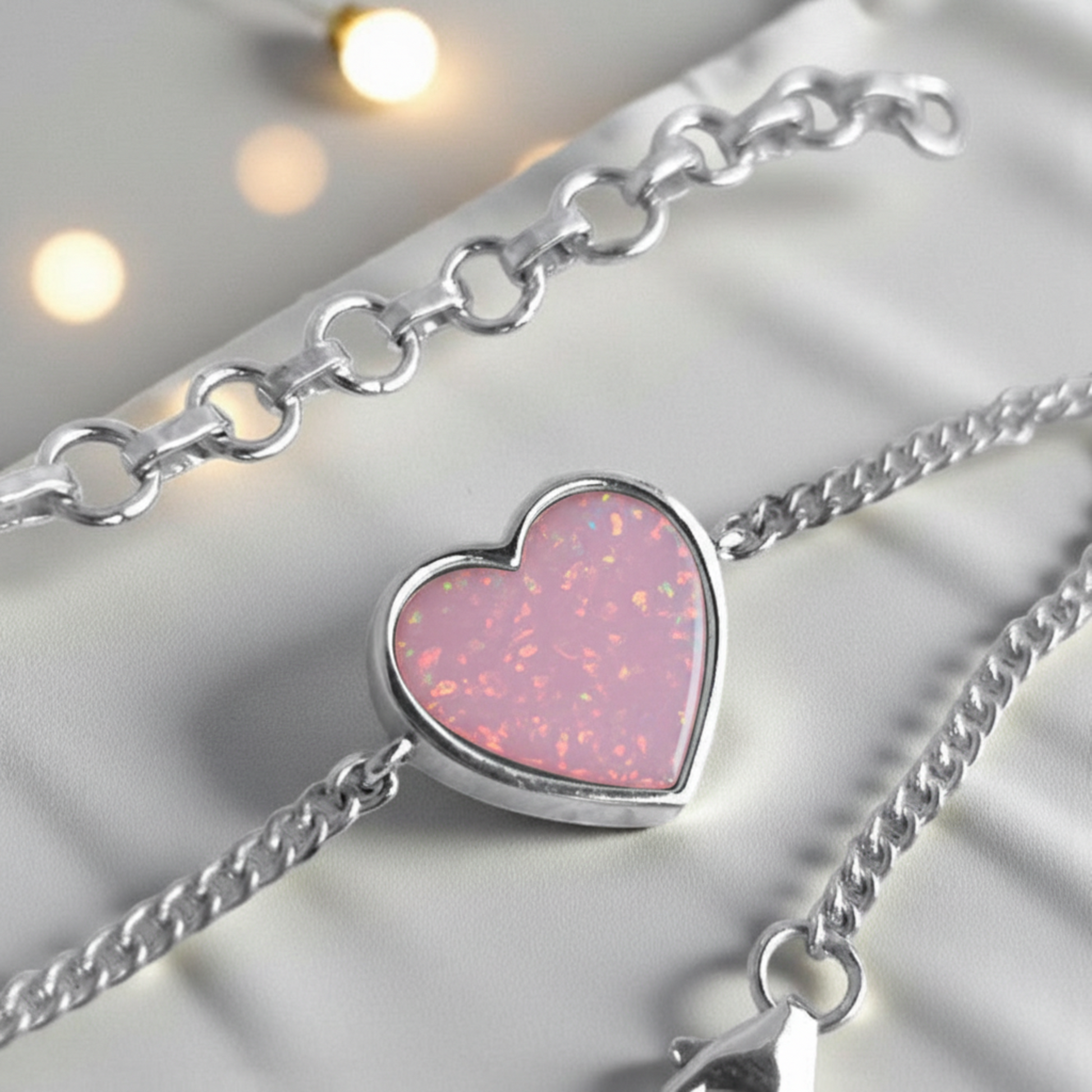 Lyra Bracelet — silver heart ashes memorial bracelet with pink opal fill,  close up view, handcrafted in Lancashire, UK